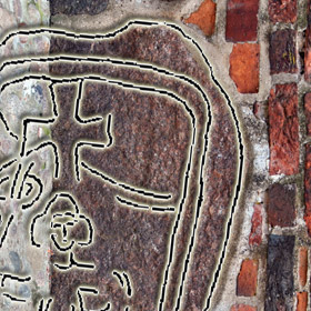 słowiańska rzeźba kultowa (Jarowit?) w ścianie zewnętrznej kościoła Św. Piotra